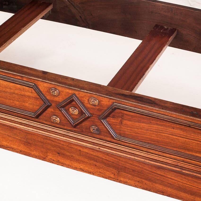 Bed made of solid walnut with marquetry details. France, 1930s.