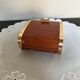 Vintage wooden cigarette box and brass curtain sliding lid