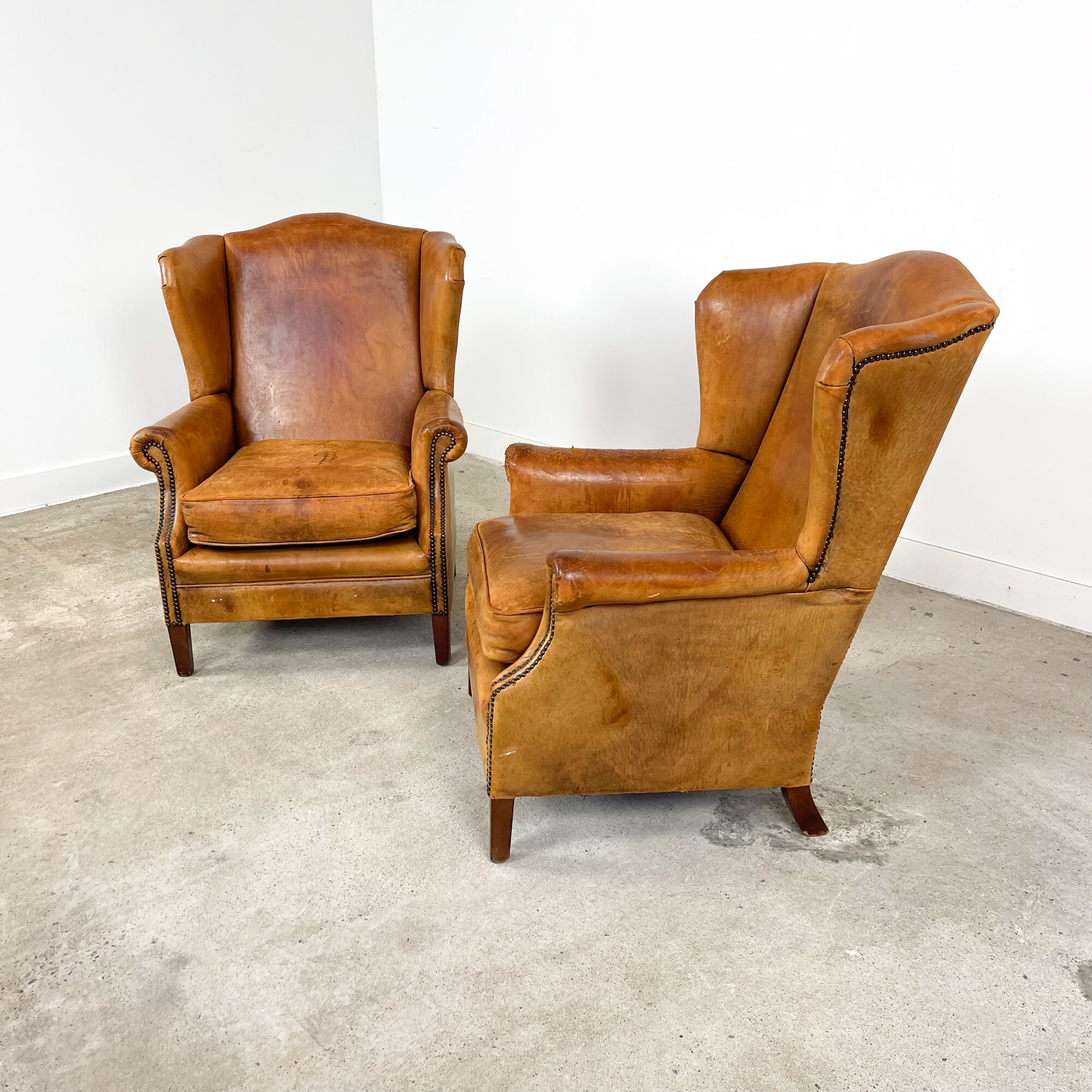 Set of two sheep leather wingback armchairs Delft