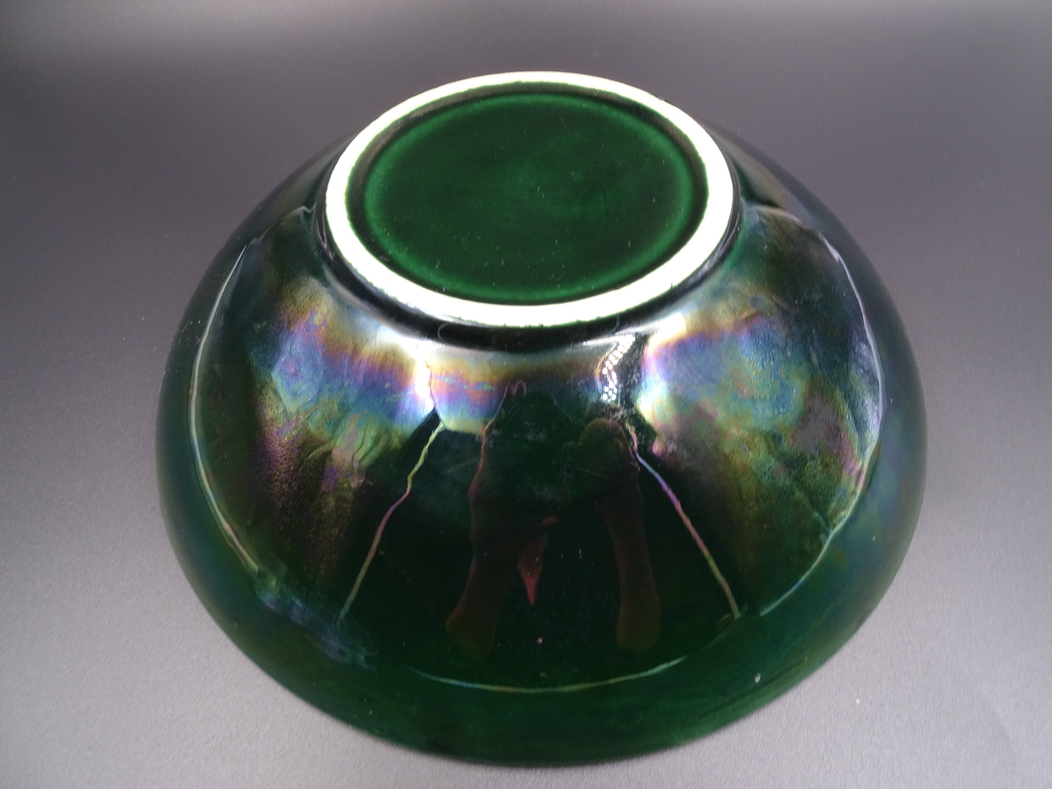 Green faience bowl decorated with multicolored drips around 1970