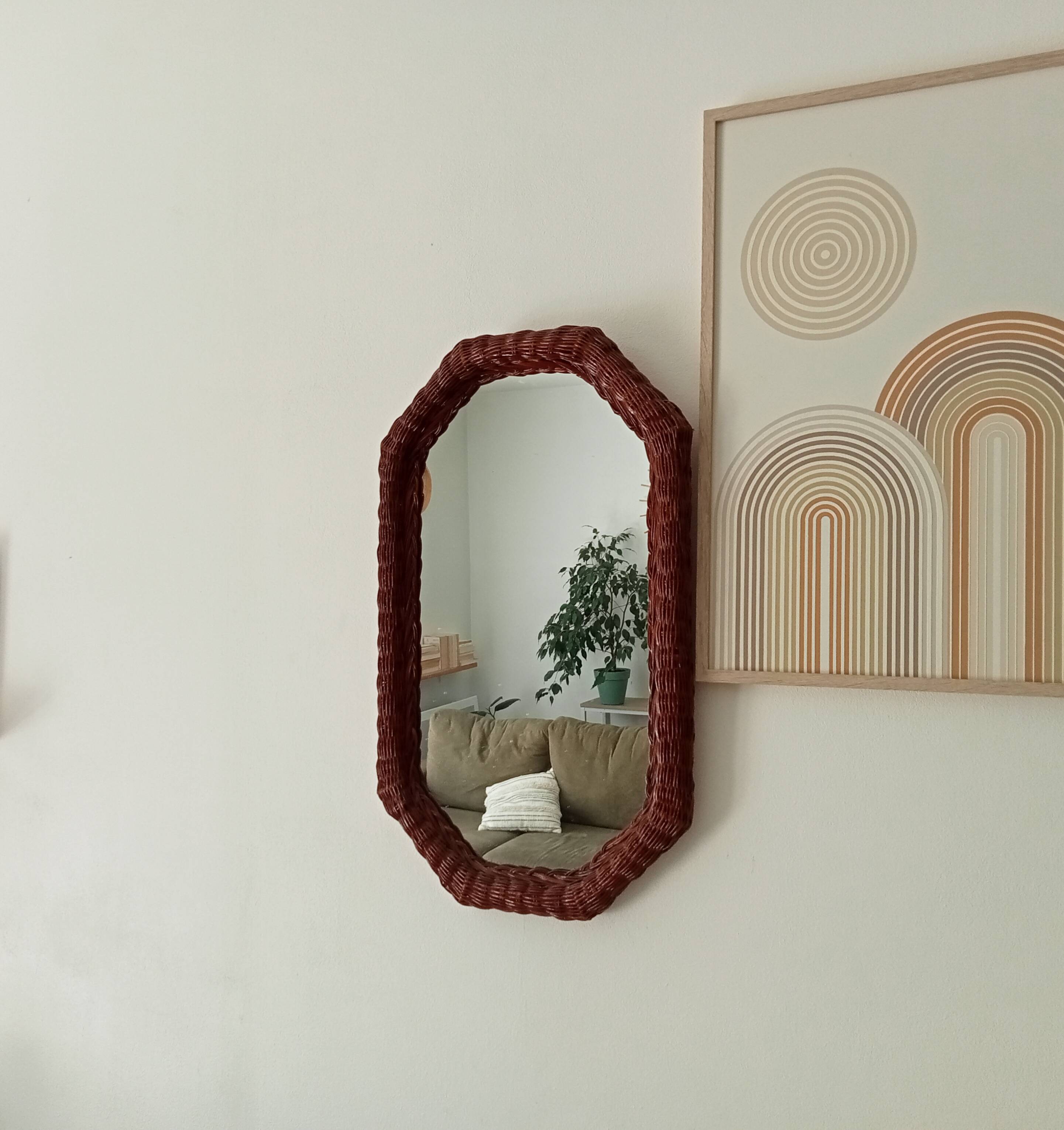 Vintage octagonal mirror in woven rattan.