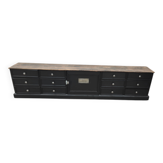 Meuble tv bas patine noire douze tiroirs et une porte