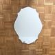 Decorative mirror with scalloped edges