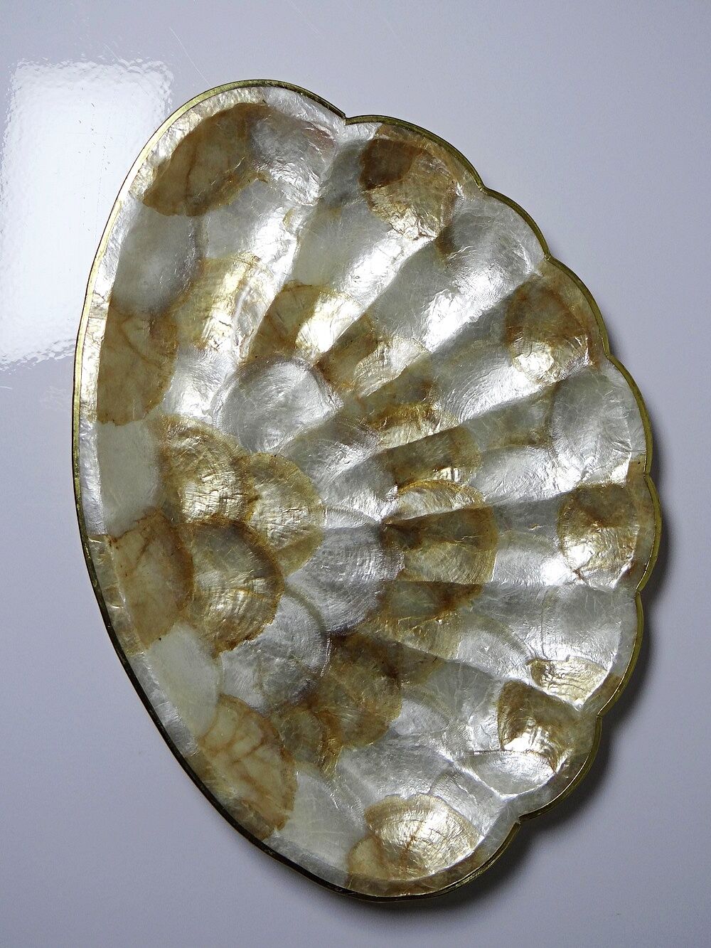 Large platter or shell-shaped catchall in capiz mother-of-pearl and vintage brass.