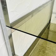 Chrome and smoked glass shelf in Italian 1970s style.