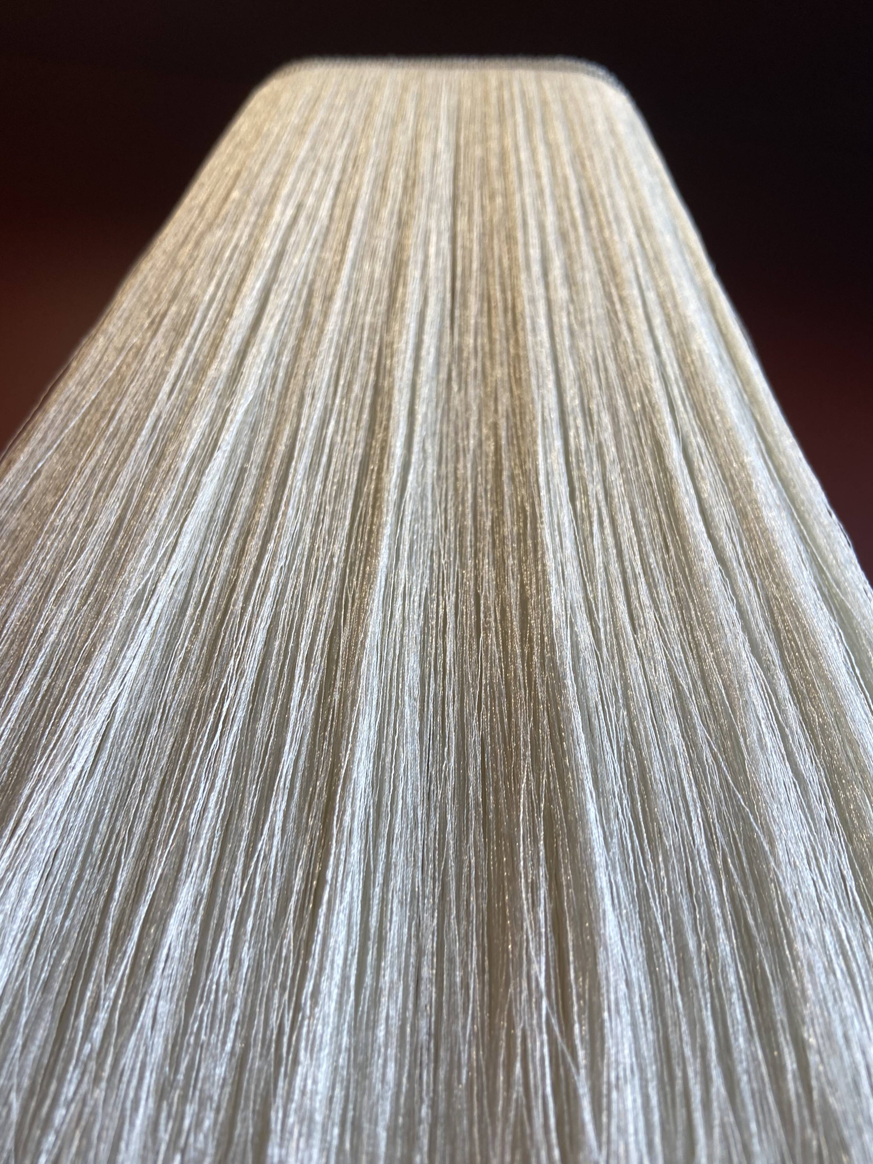 Beige marble stucco base, Houles white ecru fringed lampshade.