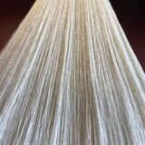 Beige marble stucco base, Houles white ecru fringed lampshade.