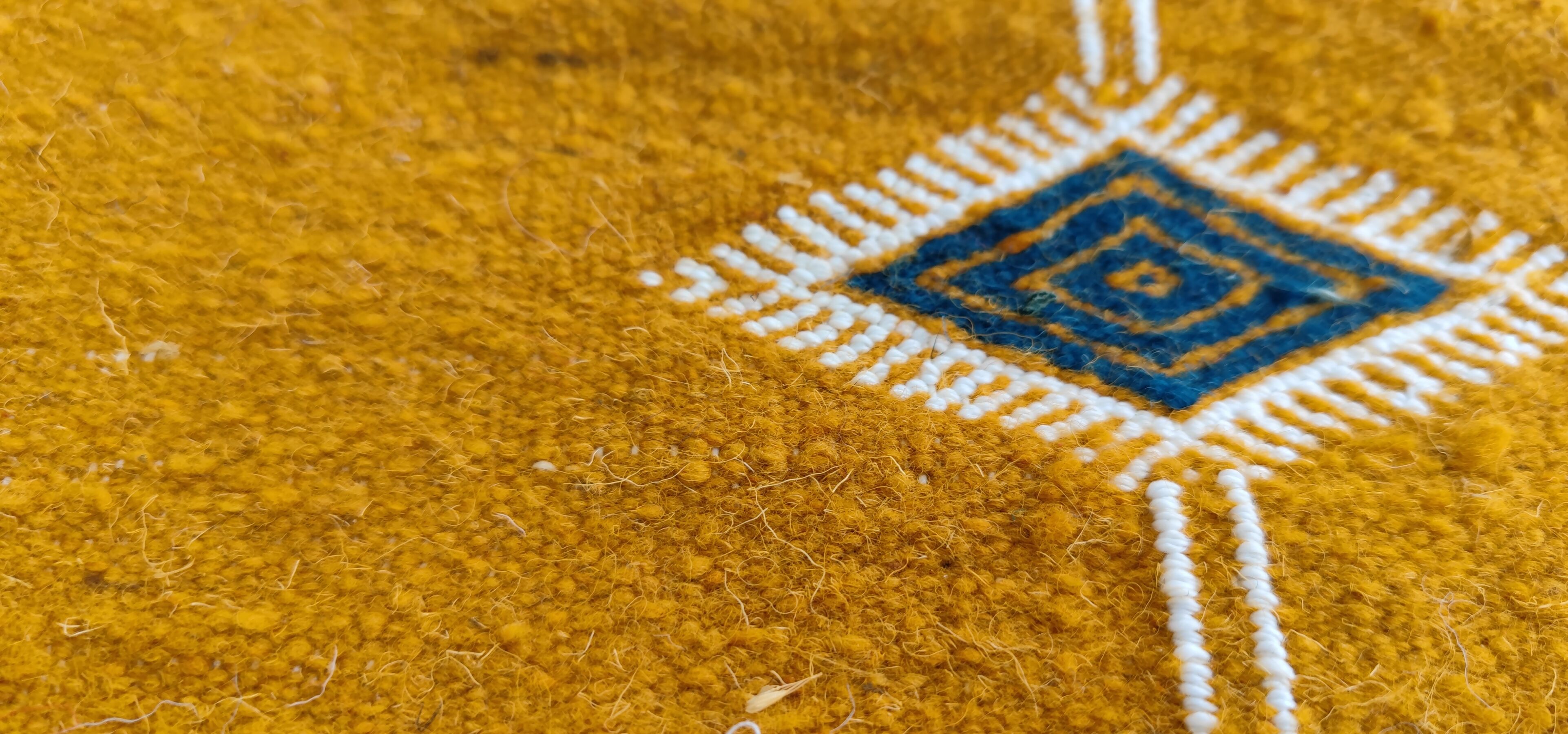 Mustard yellow kilim carpet with multicolored berber patterns