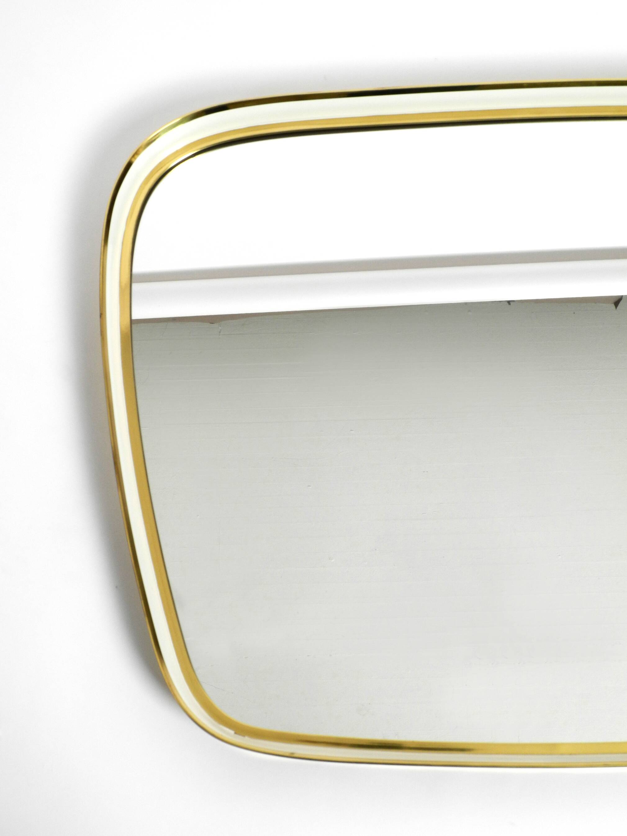 Huge Mid Century "Zier-Form" wall mirror with heavy brass frame with Label