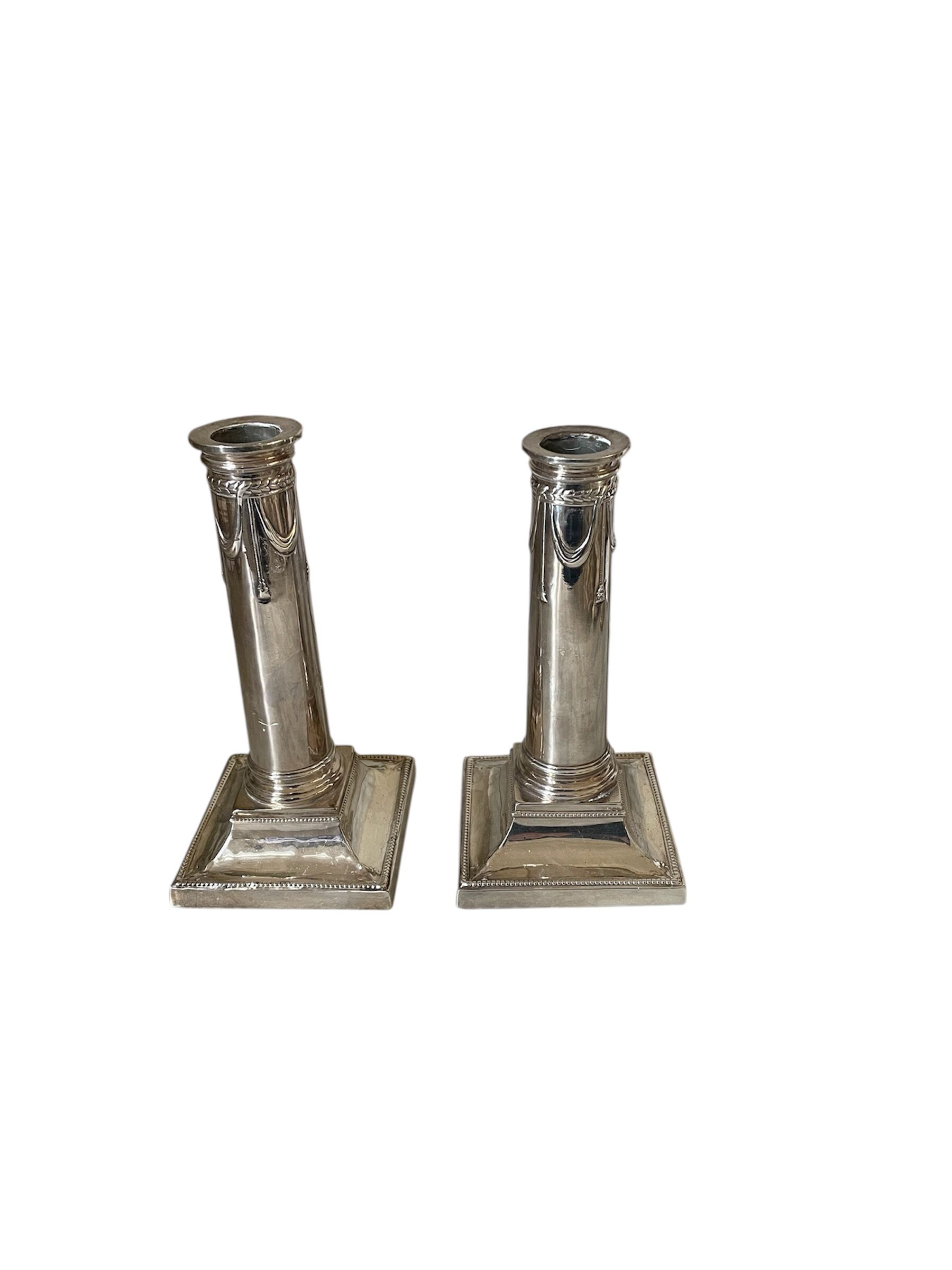 pair of Victorian style silver-plated candlesticks