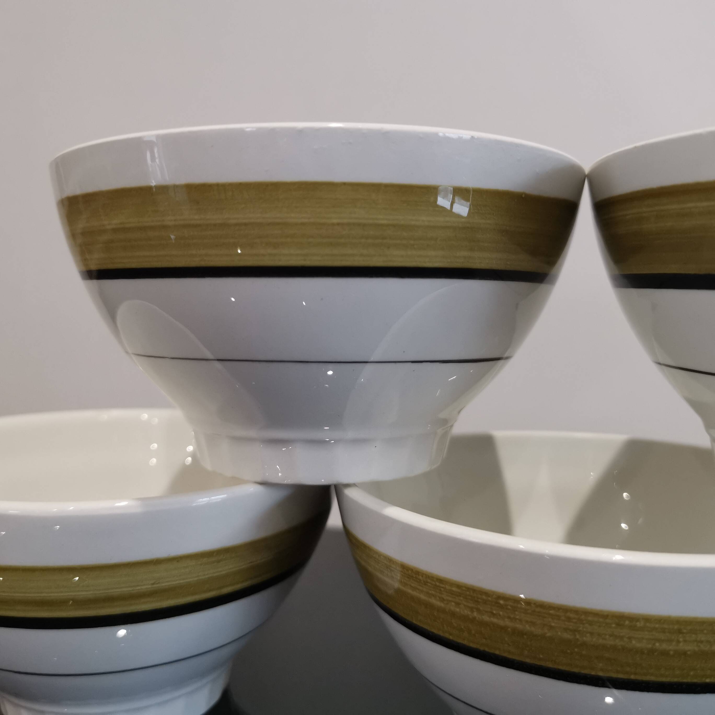 Series of 5 small old earthenware bowls with olive green edging