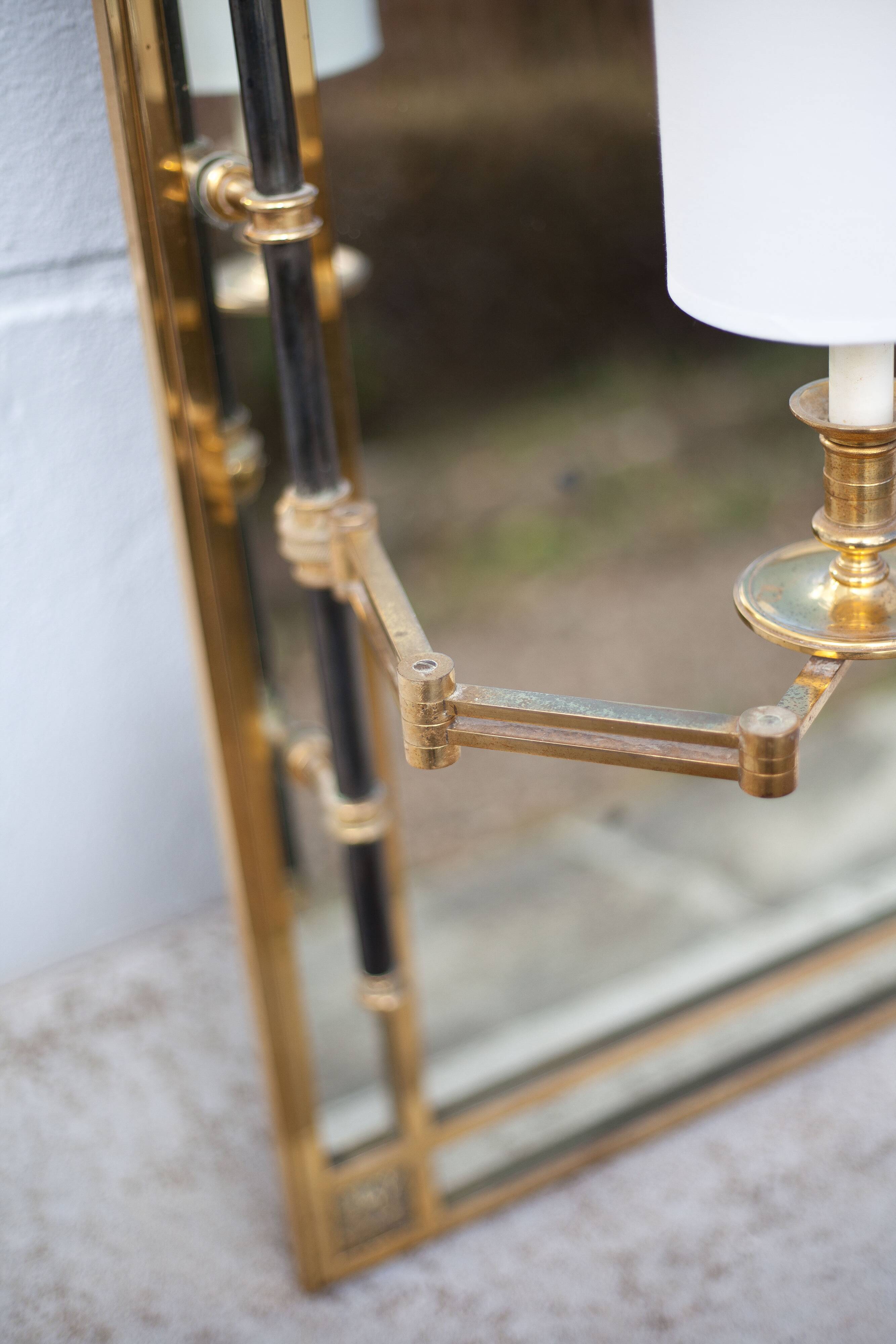 mirror with articulated wall light