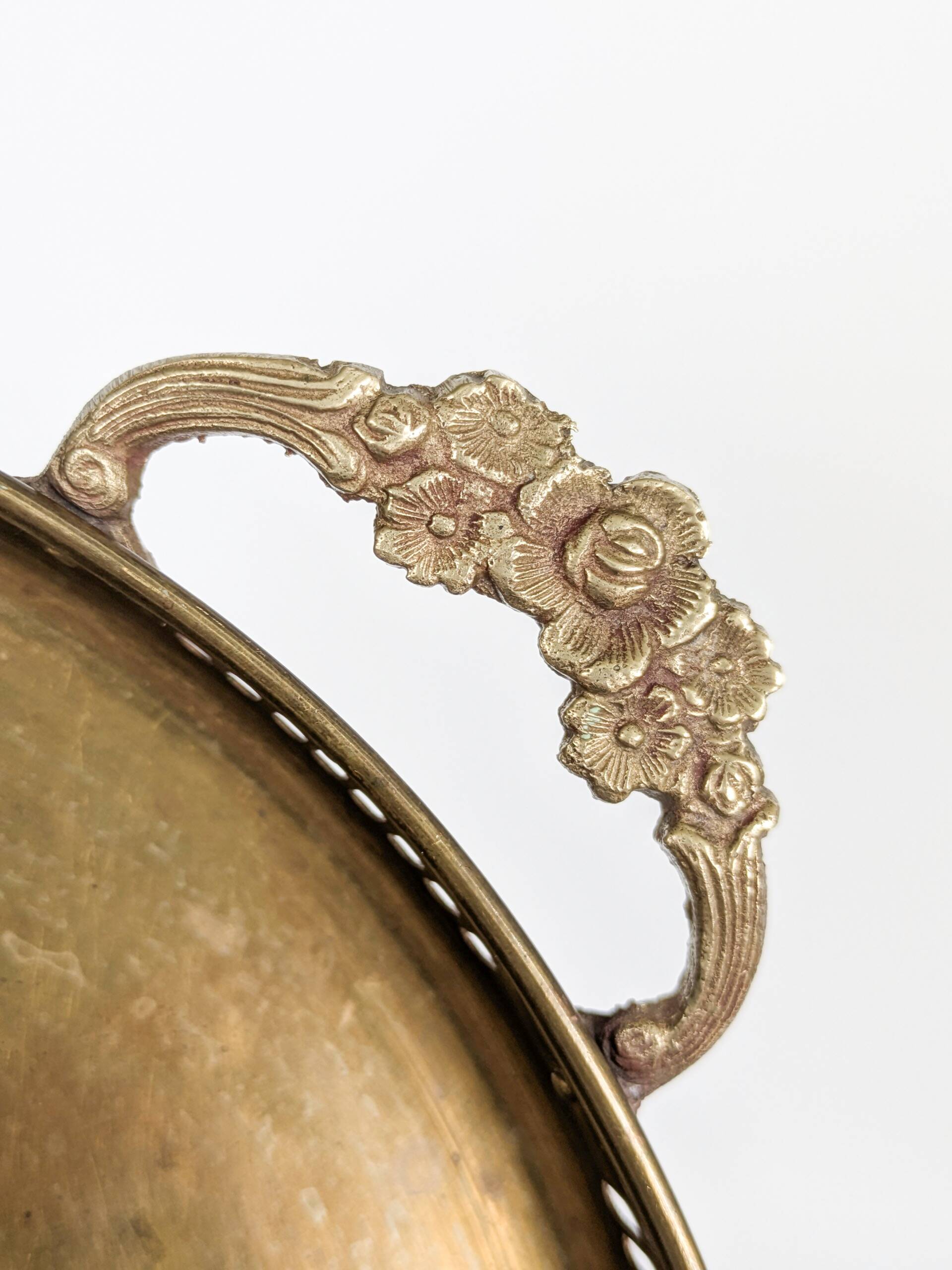 Vintage decorative brass tray, pierced edge and floral handles.