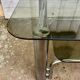 Table basse tubes chrome et verres fumés 1970