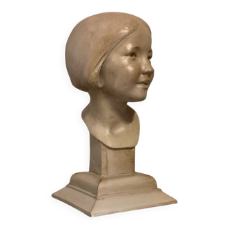 Plaster bust, young girl, monogram and date.