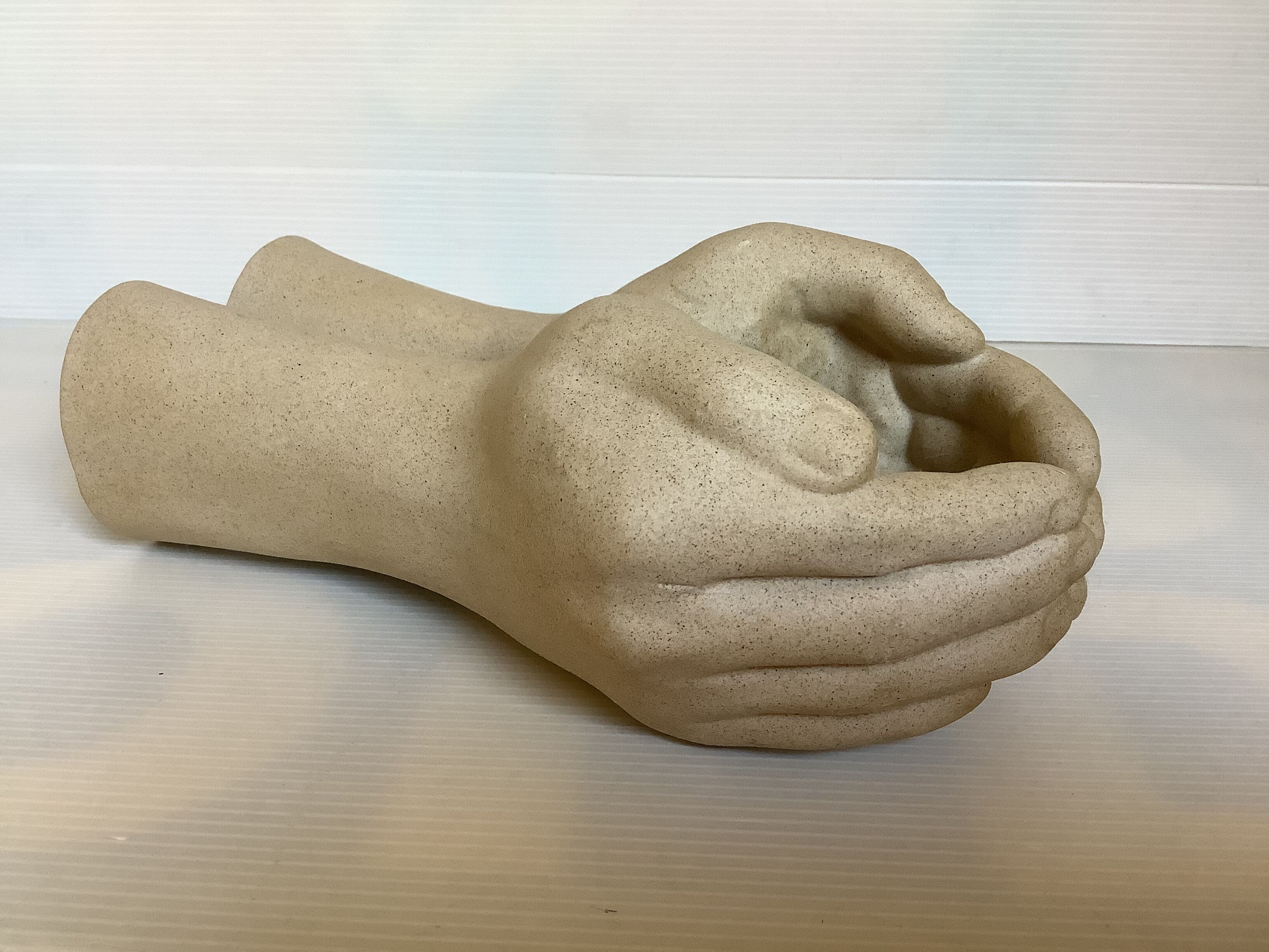 Hand-shaped candle holder