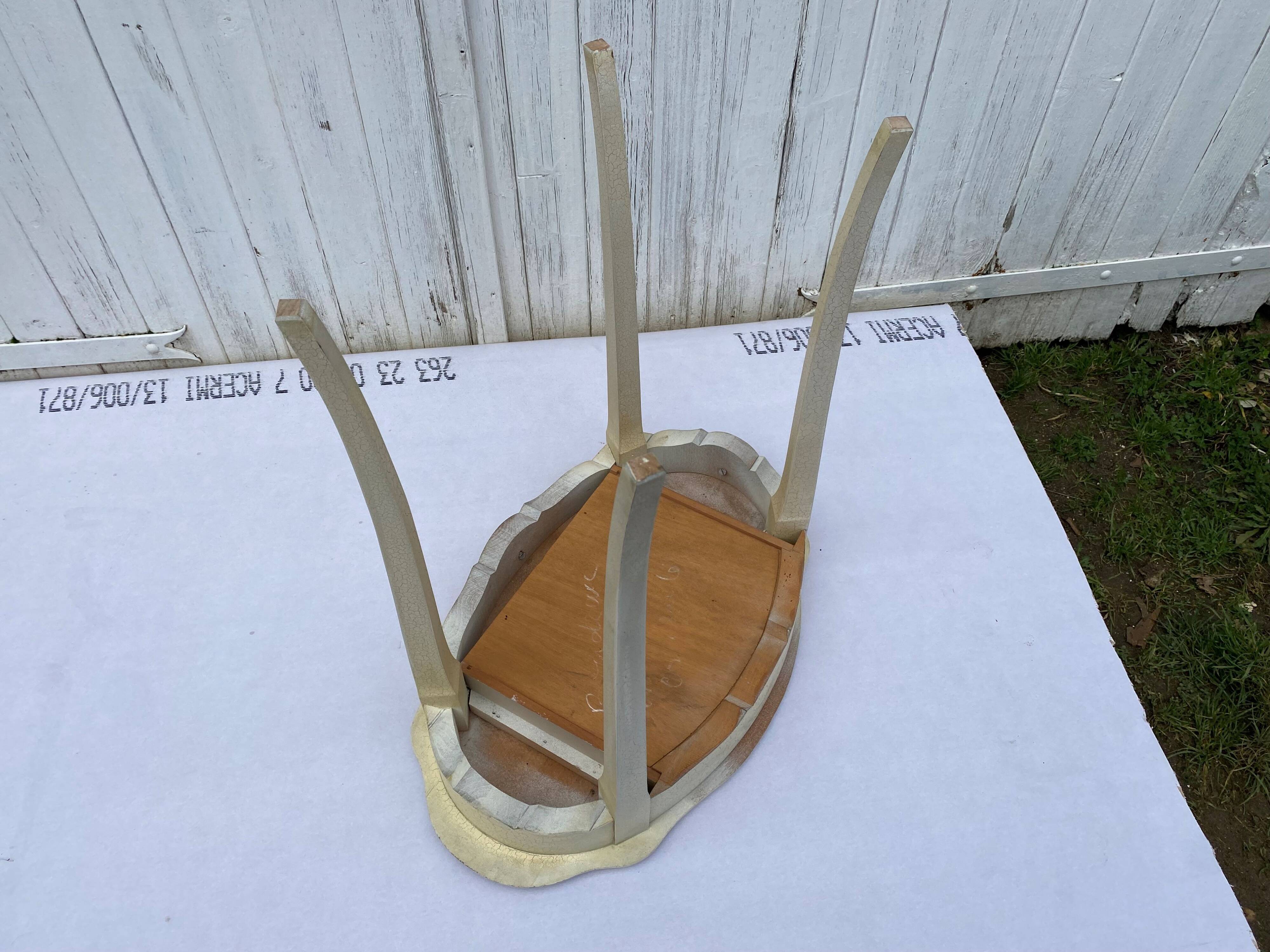 Eggshell-coloured drawer with a cracked effect side table.