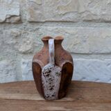 Old small pitcher in glazed terracotta