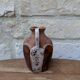 Old small pitcher in glazed terracotta