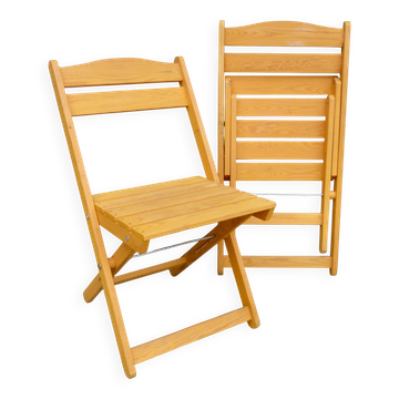 Pair of light wood folding chairs