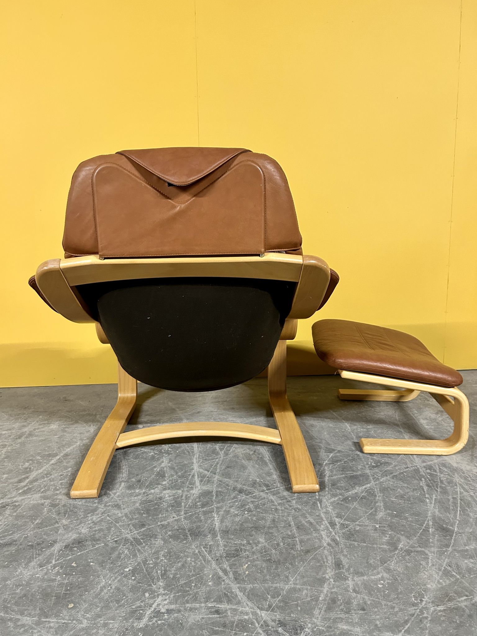 Danish vintage cognac leather armchair and footstool by Skipper Mobler