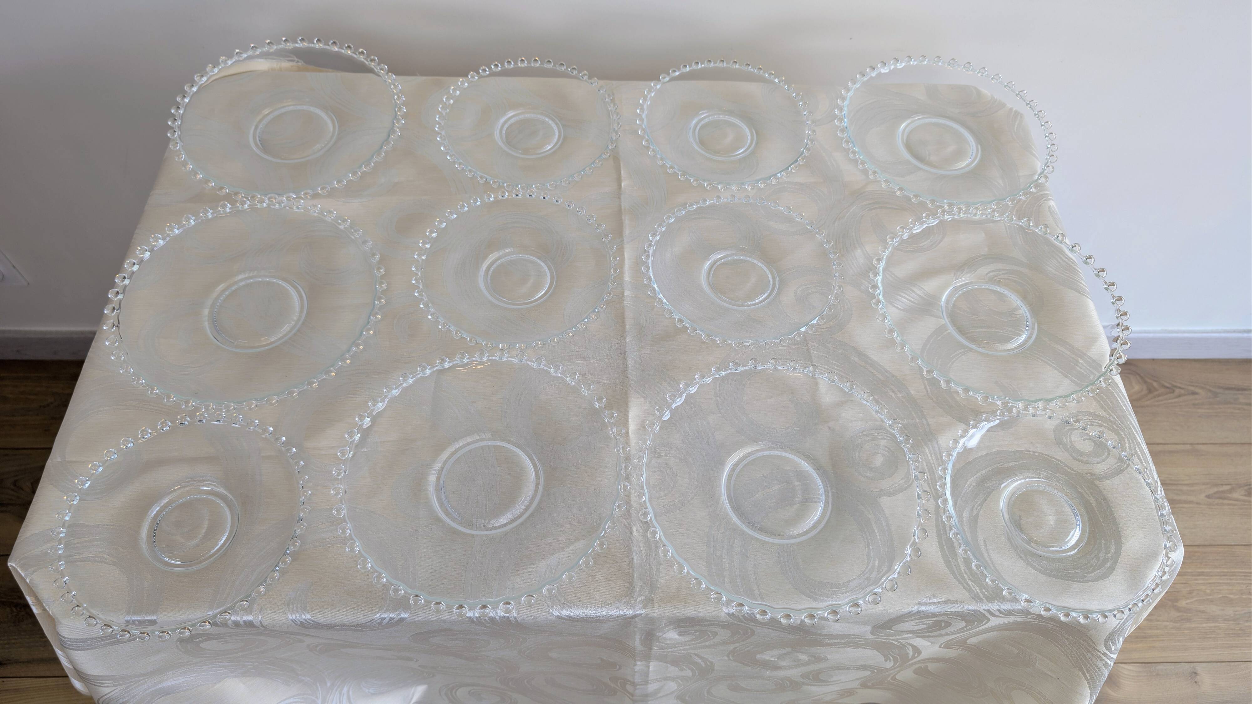 Vintage service of 12 pressed glass plates with bead decoration.