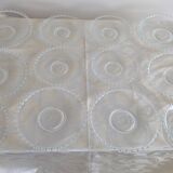 Vintage service of 12 pressed glass plates with bead decoration.