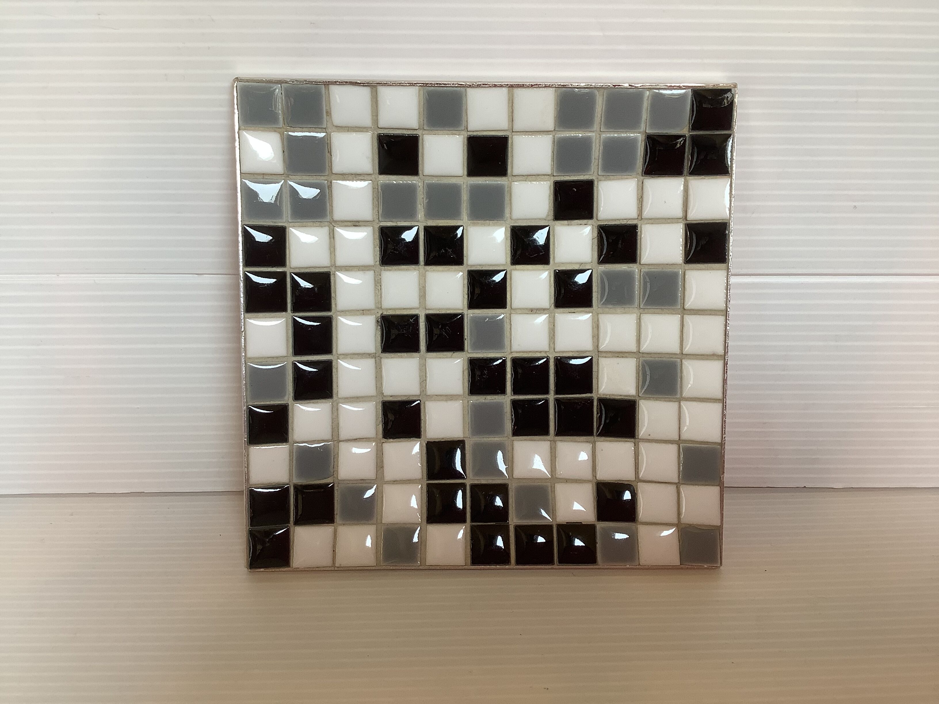 Mosaic grey, white, and black catch-all tray.