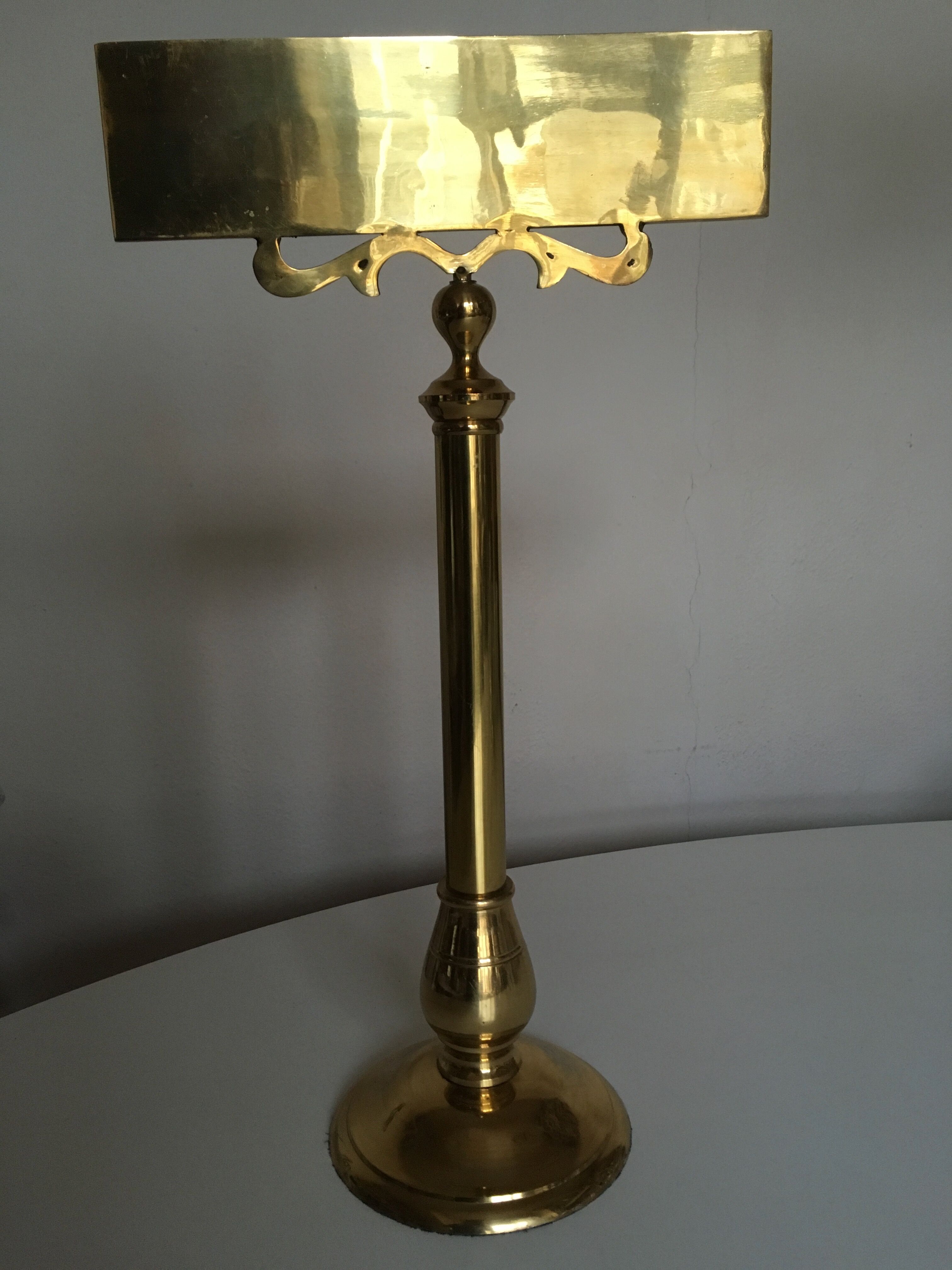 Brass palace brasserie counter plate on foot