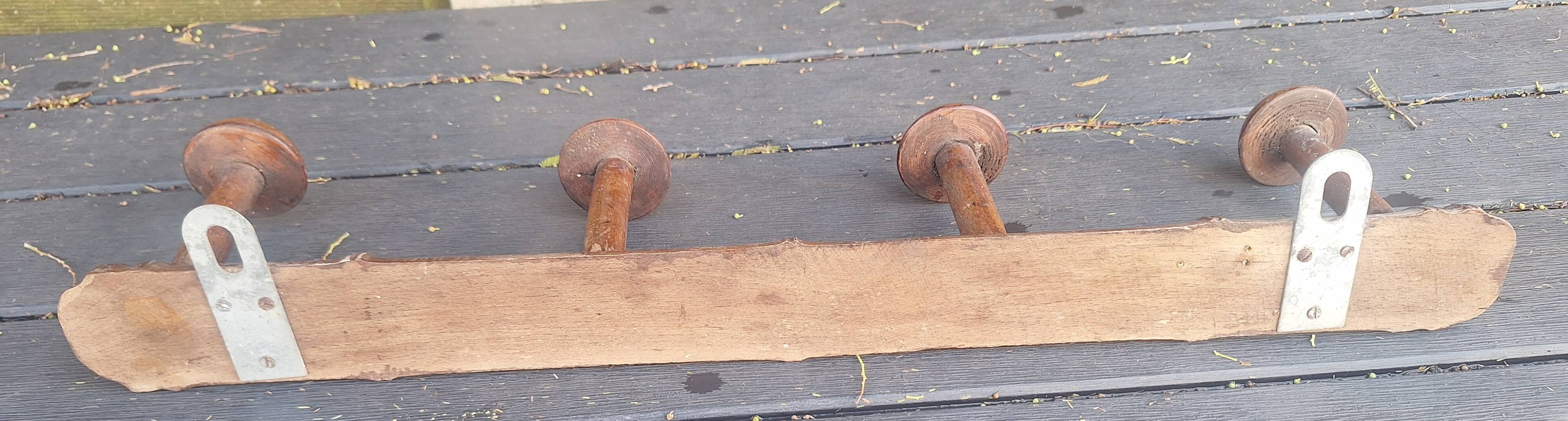 Old wooden coat hook imitating bamboo.