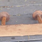 Old wooden coat hook imitating bamboo.
