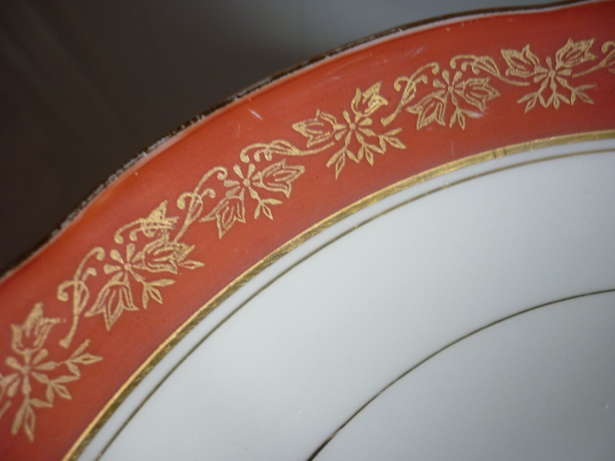 Plate and limoges porcelain dish with orange and gold trim
