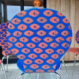 Blue and terracotta ant chairs with eye pattern