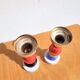 Pair of coloured and gold wooden candlesticks