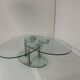 Oval designer coffee table in tempered glass