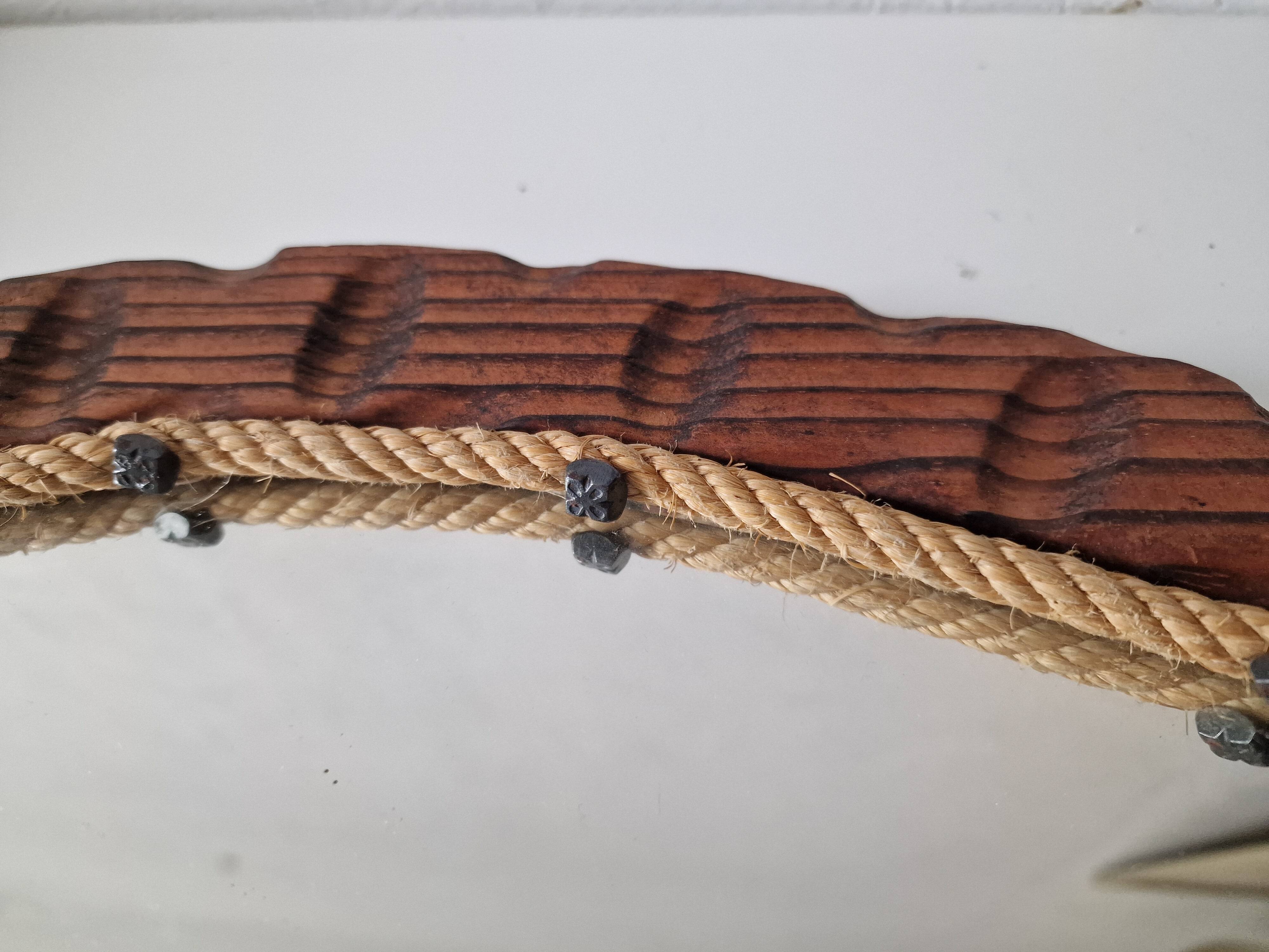 Brutalist mirror in wood and rope, free form.