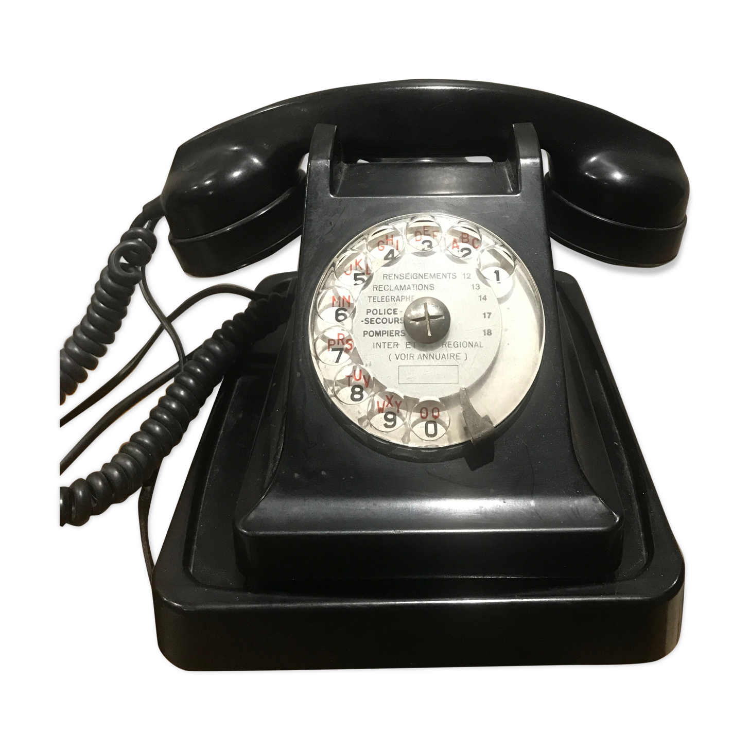 Black bakelite dial telephone with support