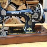 Old Singer sewing machine on its original base
