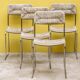 Four straw-seated chairs from 1980.