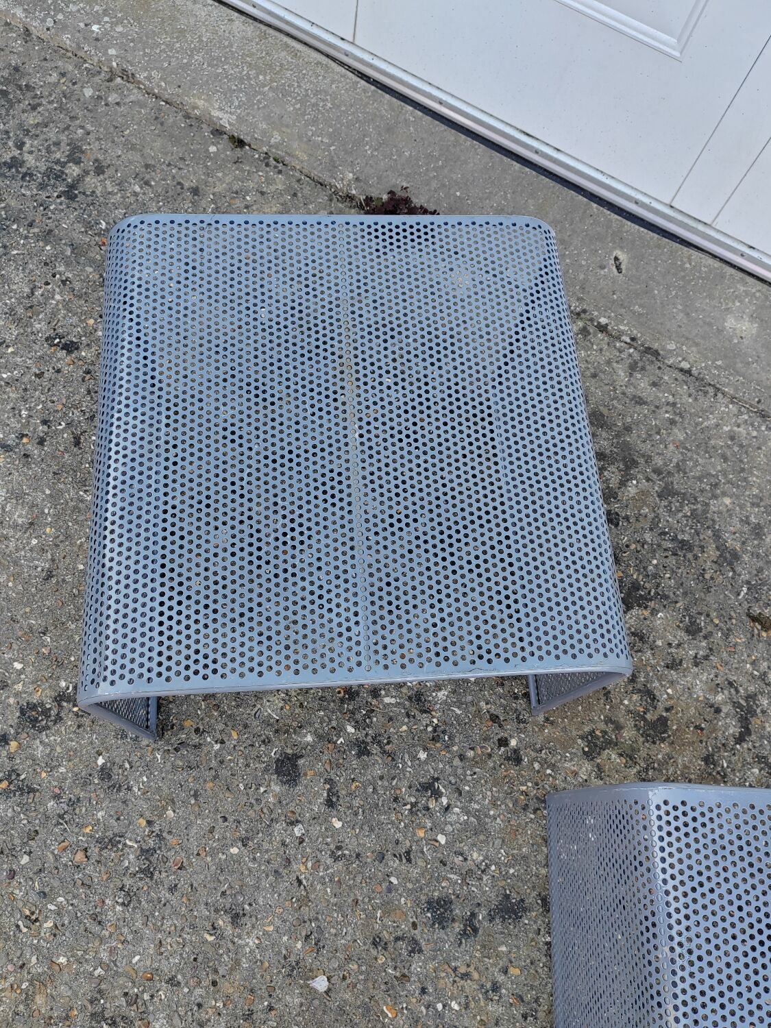 Nested tables with perforated metal from the 1980s.