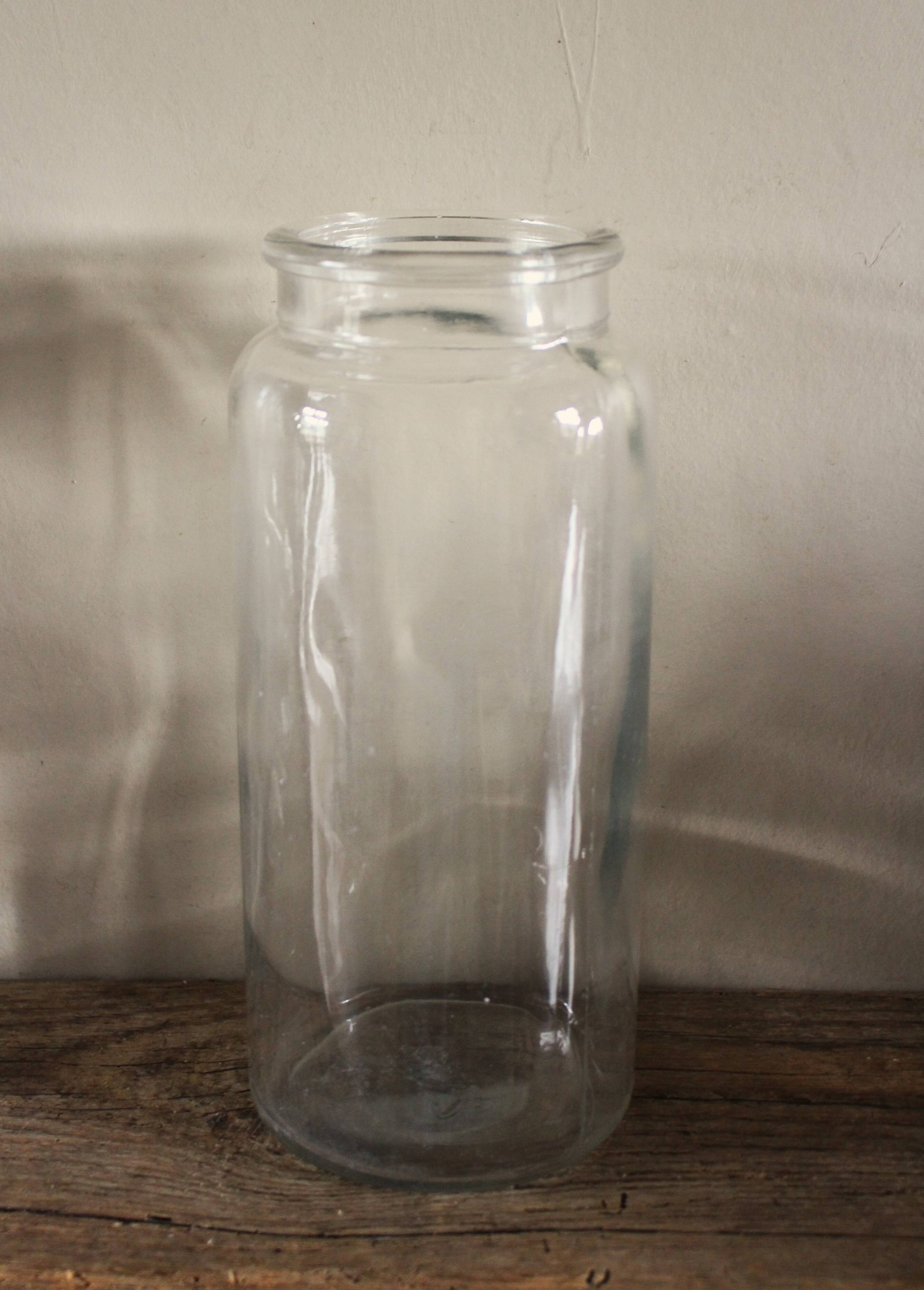 Large antique transparent glass bottle vase