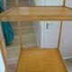 Storage column, wooden bookshelf and woven rattan.