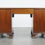 Antique wooden English desk from the late 19th century with a leather top
