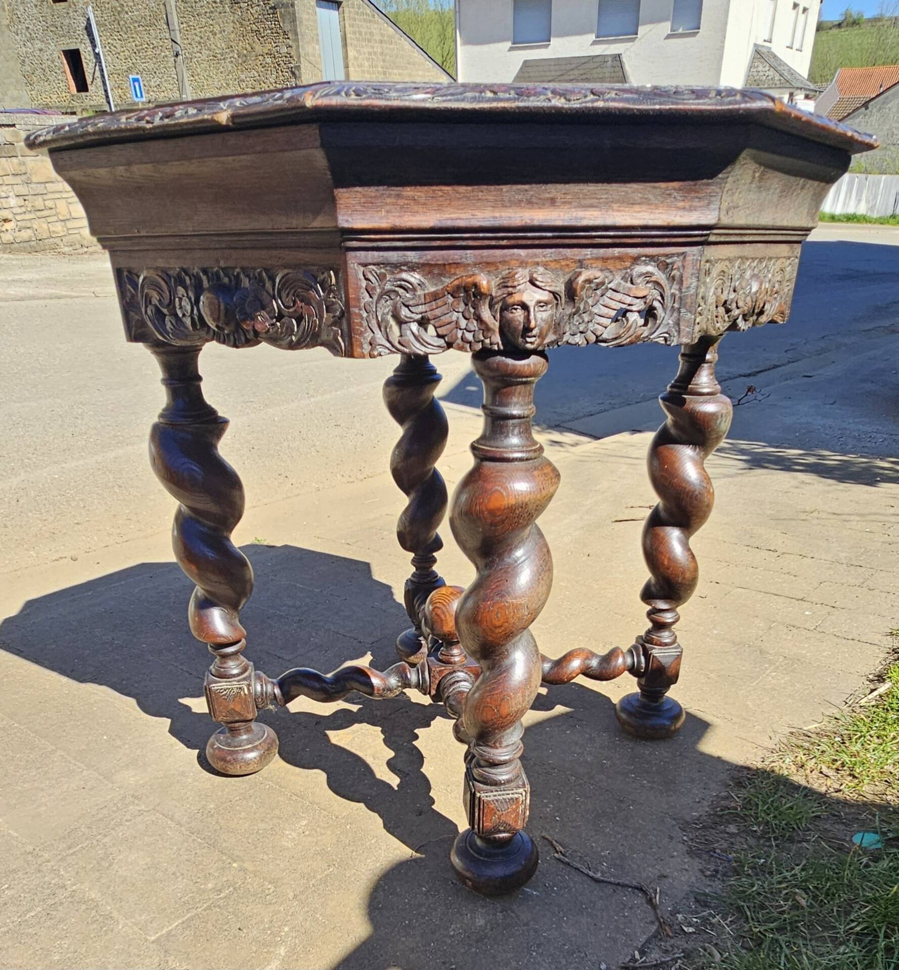 Large octagonal side table in carved solid oak, s