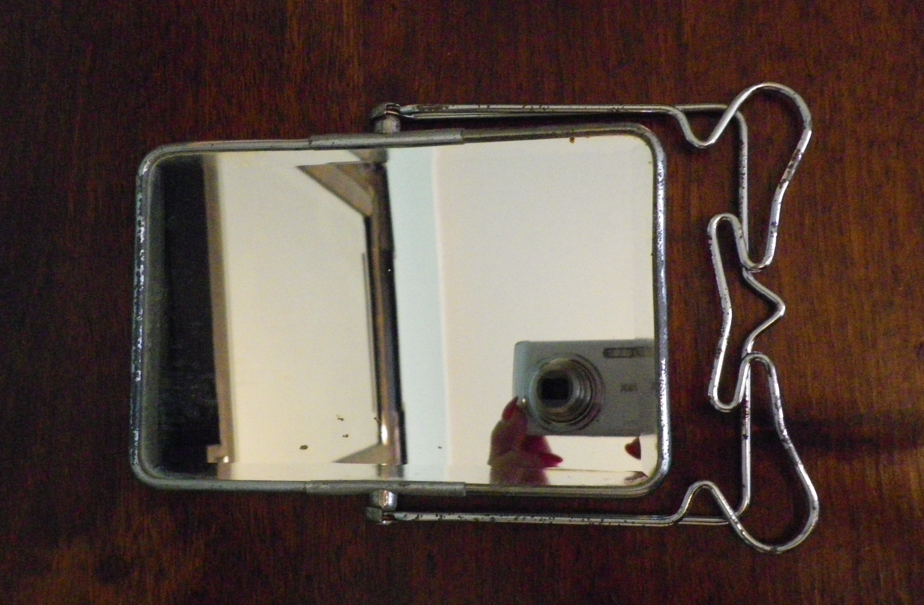 Two-foot barber mirror, suspension mode, beveled, chrome metal - 70s -