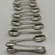Service of 12 silver-plated metal coffee spoons with tongs and box from around 1900.