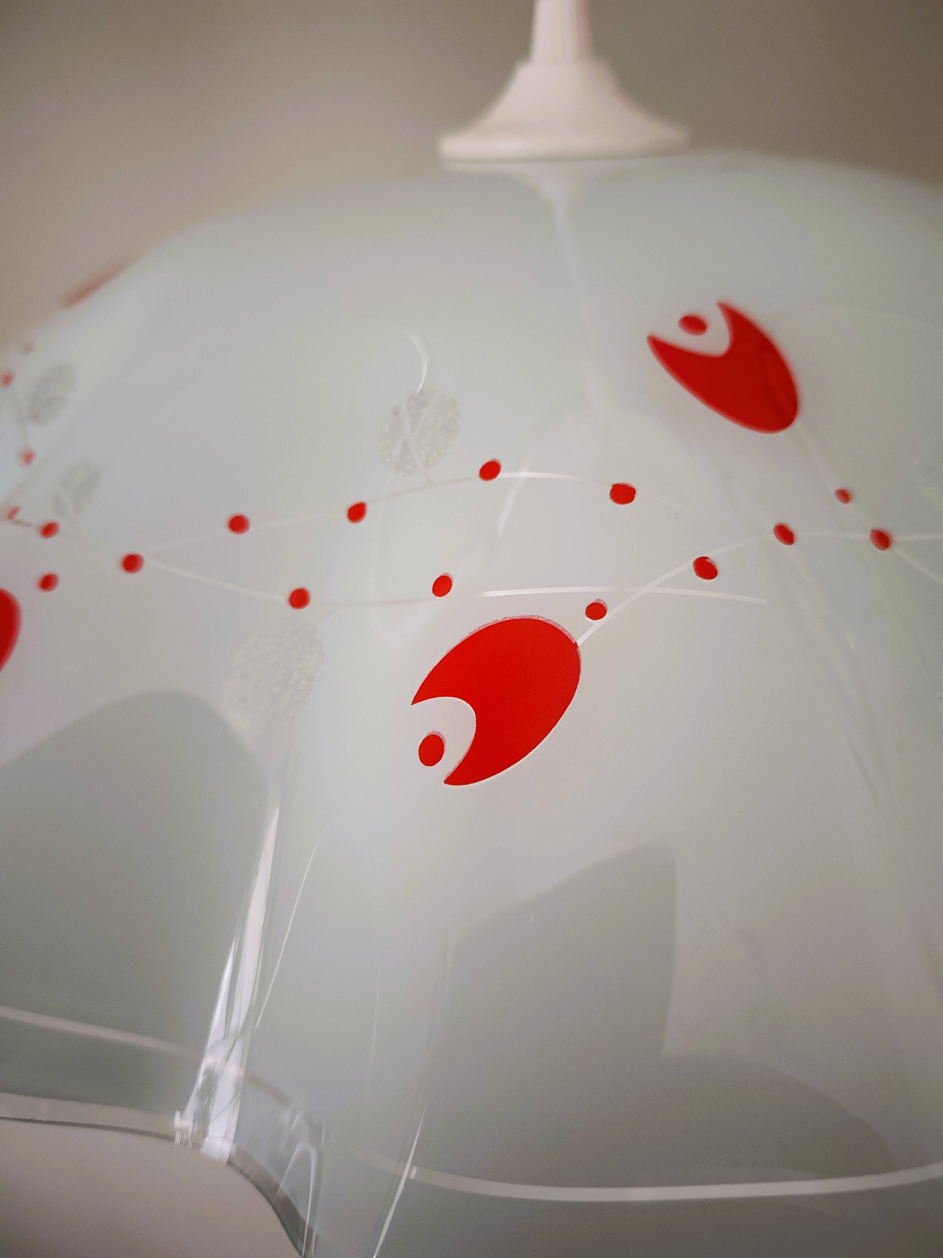 White opaline glass suspension with red and silver floral decoration.