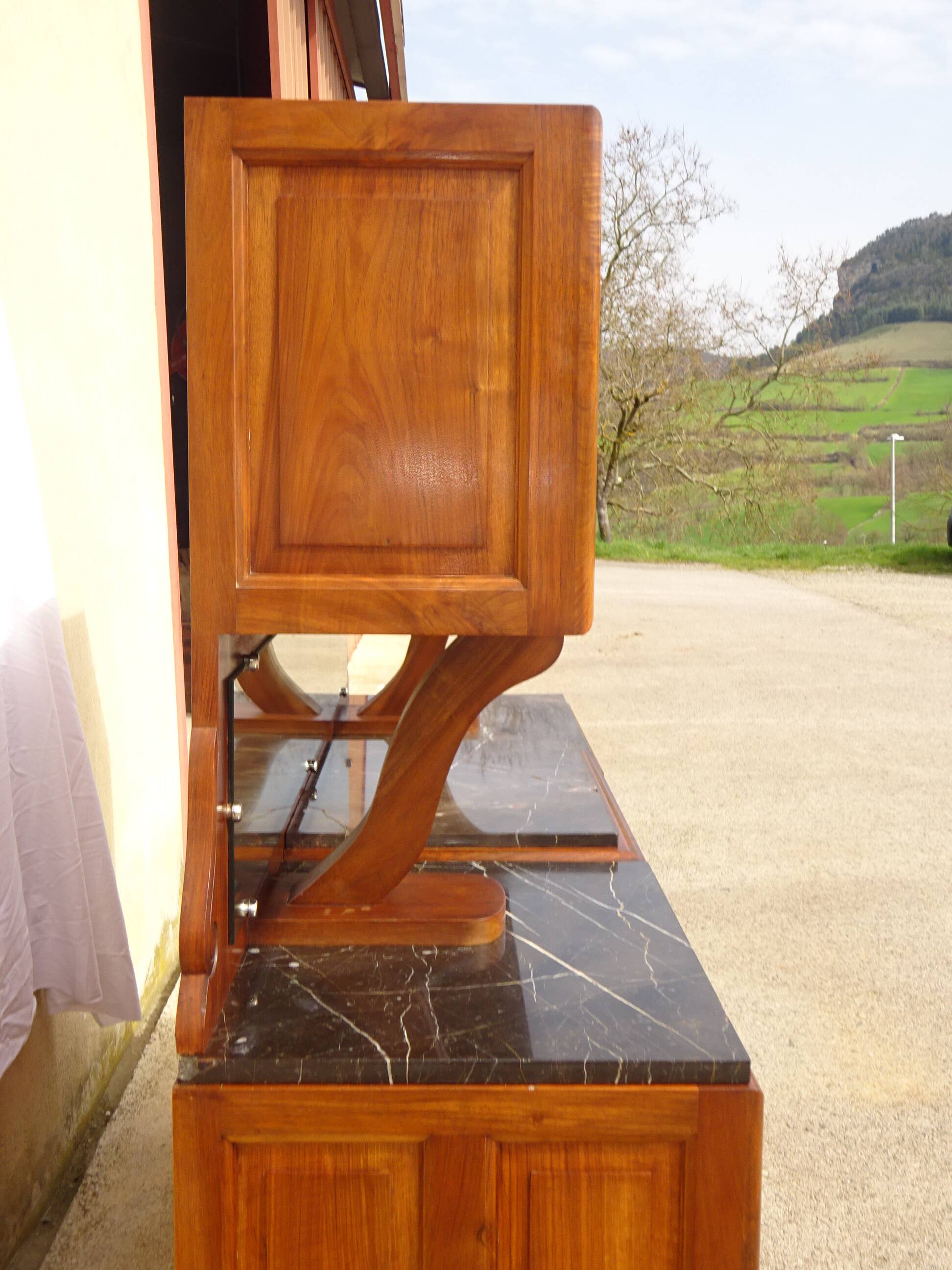 Solid walnut sideboard, moustache legs, black marble top.