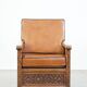 Fauteuil ancien en peau de mouton retapissée