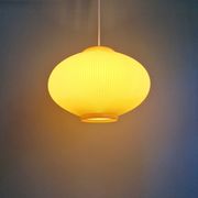 Vintage oval-shaped suspension in pleated celluloid, light green colour, 1960.